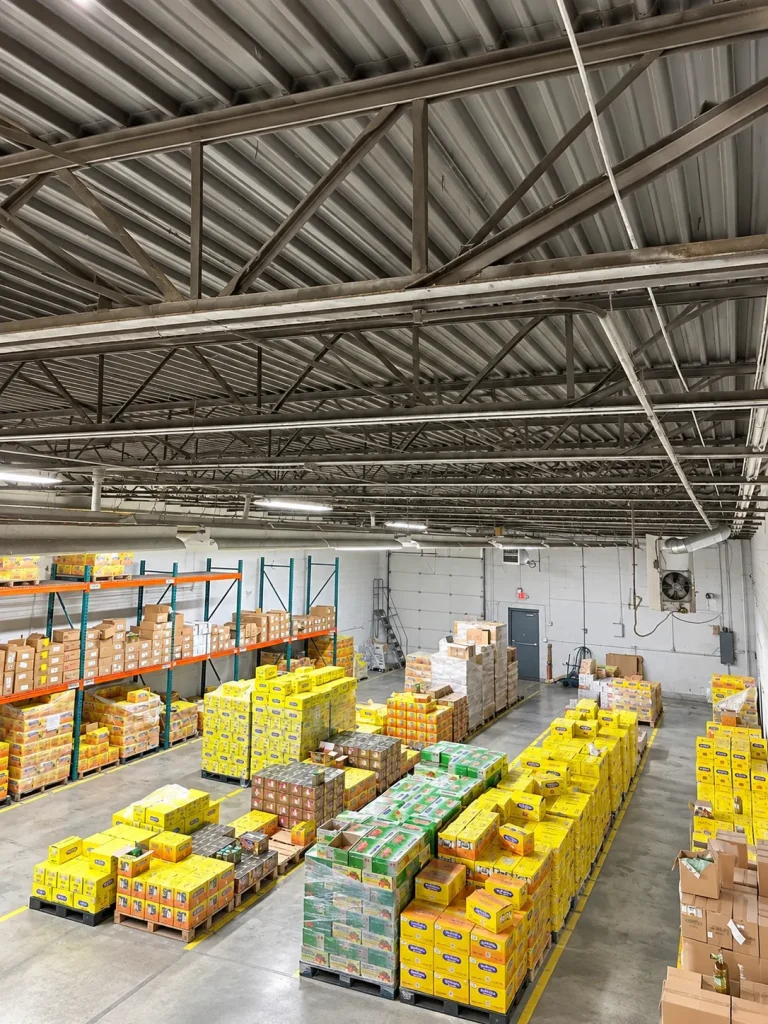 Warehouse floor with pallet racking and stocked shelving